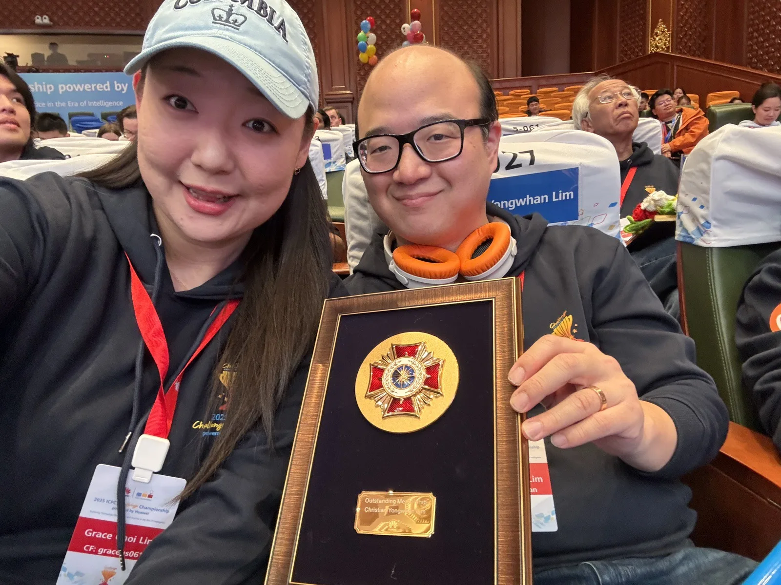 Grace Hui Lim and Christian Lim holding the Quatrefoil Medal at the 2025 ICPC Challenge Championship in Shanghai